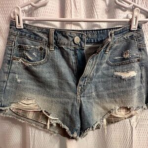 American Eagle size 4 cut off jean shorts. Plaid pockets stick out